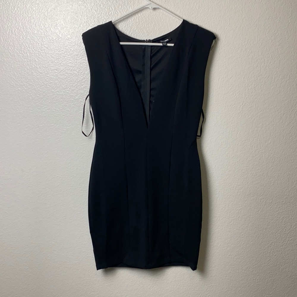 Plunging black mini dress